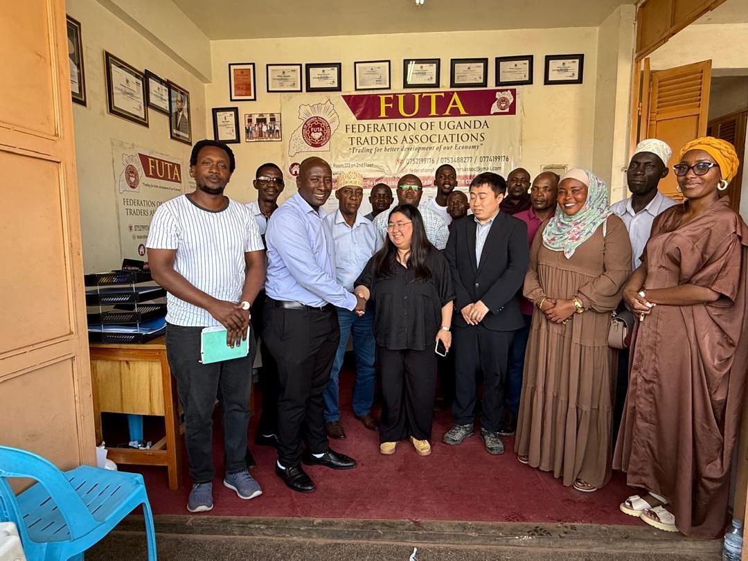 President John Kabanda shaking hands with a visiting partner at FUTA headquarters